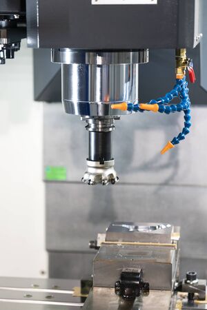 machining precision part by CNC machining centerの写真素材