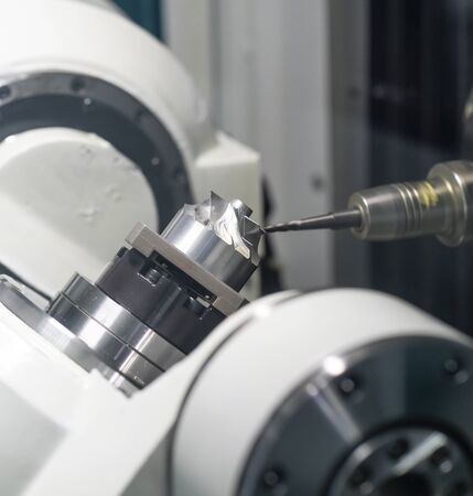 machining precision part by CNC machining centerの写真素材