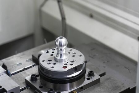 machining precision part by CNC machining centerの写真素材