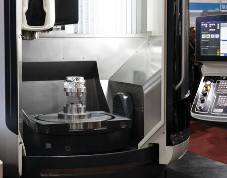 machining precision part by CNC machining centerの写真素材