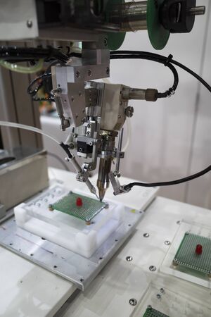 robot arm for automatic production line, high tech manufacturing process, high precision robotic arm for accuracy workの写真素材