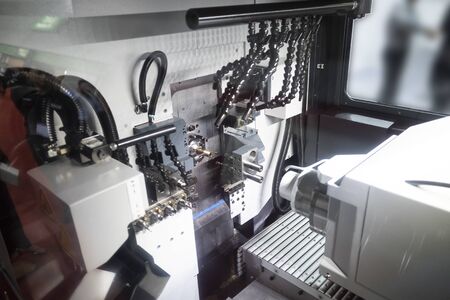 Operator machining automotive part by cnc turning machine, high accuracy with multi axis, multi spildle cnc turning and milling machineの写真素材