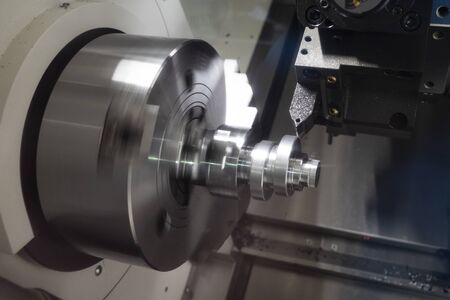 Operator machining automotive part by cnc turning machine, high accuracy with multi axis, multi spildle cnc turning and milling machineの写真素材