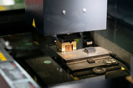 operator use copper EDM electrod to make precision mold and dieの写真素材