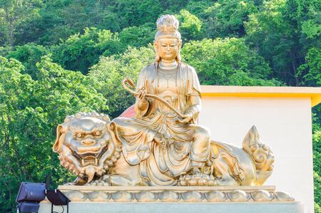 Statue of Guan Yin on His backgroundの写真素材