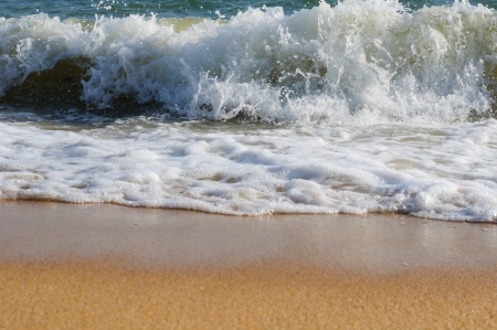 Small waves washed up the shoreの写真素材