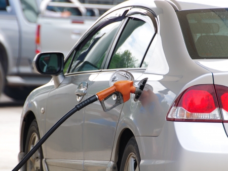 Detail of a fuel pump filling up silver carの写真素材