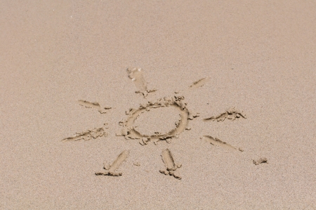 Sun drawing on the sandの写真素材