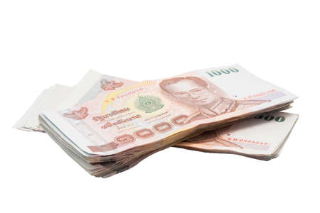 Stacks of 1000 baht bills isolated on white backgroundの写真素材
