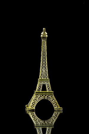 Small Eiffel tower isolated on over black backgroundの写真素材