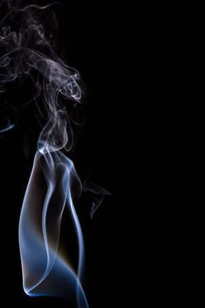 Abstract incense smoke isolated on black の写真素材