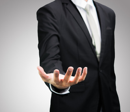 Businessman standing posture show hand isolatedの写真素材