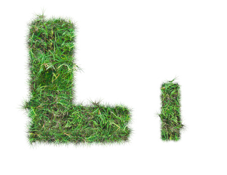 letter L on green grass isolated on over white backgroundの写真素材