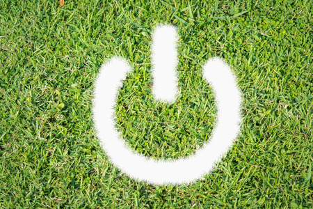 Green turf power switch on off made of green grassの写真素材