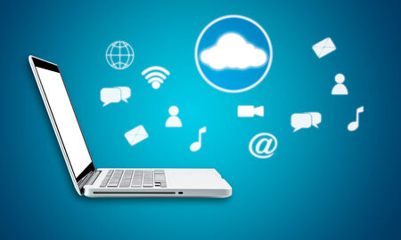 Cloud computing laptop technology connectivity concept on blue backgroundの写真素材