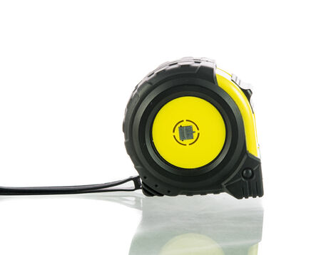 Yellow tape measure isolated on over white background