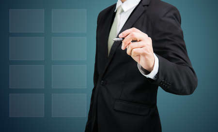 Businessman drawing cloud computing network technology connectivity on drak backgroundの写真素材