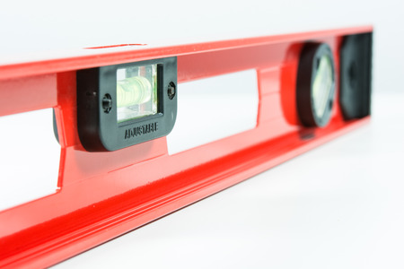 Red spirit level isolated on over white backgroundの写真素材