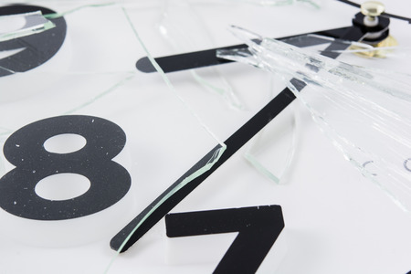 White clock is broken glass isolated on white backgroundの写真素材