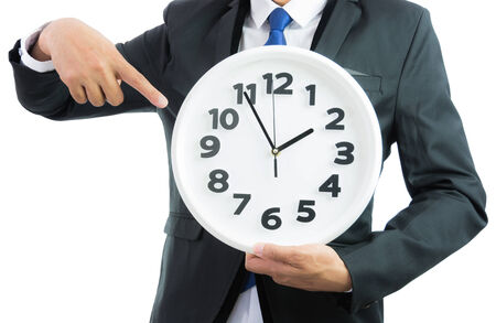 White clock holding in businessman hands isolated on over white backgroundの写真素材