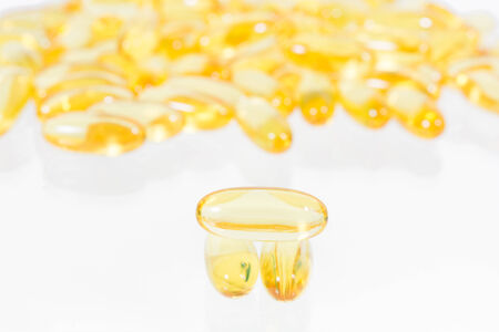 Omega 3 fish oil capsules texture background