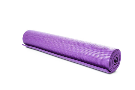 Close up purple yoga mat for exercise isolated on over white backgroundの写真素材
