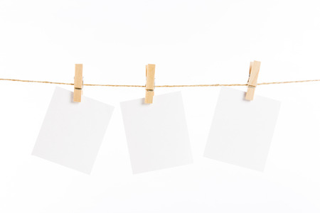 paper cards hanging rope isolated on white backgroundの写真素材