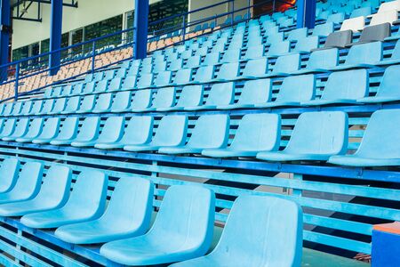 Sport stadium plastic chairs on bleachers view rowの写真素材