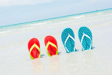 Beach, slippers on tropical beach in holiday at Thailandの写真素材
