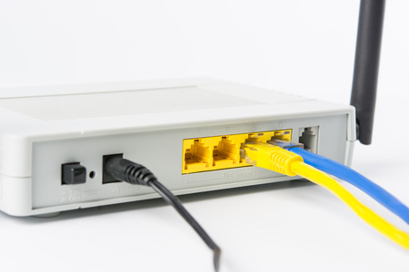 Wireless modem router network hub on white backgroundの写真素材