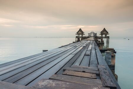long bridge over the sea with sunrise of Thailandの写真素材