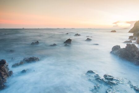 Sunset coastal with rock stone of Thailandの写真素材