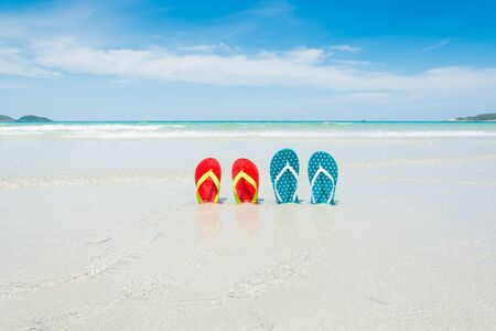 Beach, slippers on tropical beach in holiday at Thailandの写真素材