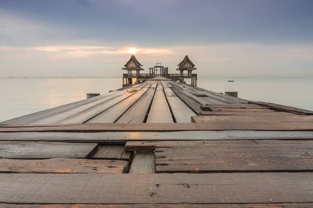 long bridge over the sea with sunrise of Thailandの写真素材