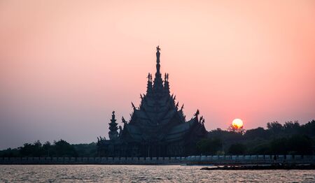 Silhouette Sanctuary of Truth temple construction on sunset in Pattaya, Thailandの写真素材