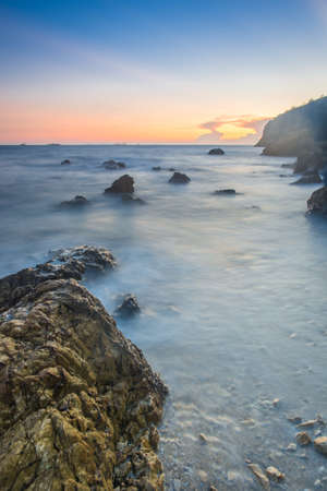 Sunset coastal with rock stone of Thailandの写真素材