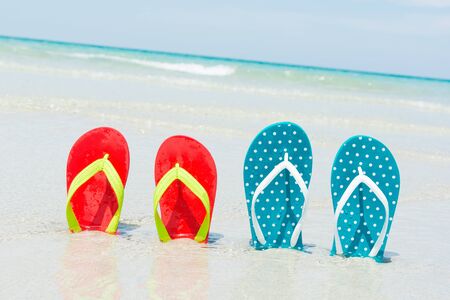 Beach, slippers on tropical beach in holiday at Thailandの写真素材