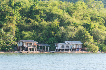 Old house on stilts over the sea at Thailandの写真素材