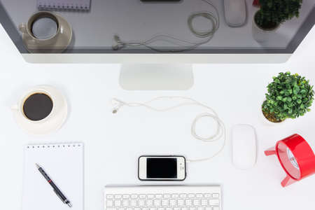 Business office top view computer monitor on white tableの写真素材