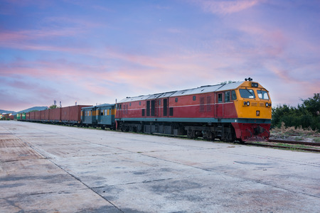 Cargo train and container at twilight of Thailandのeditorial素材