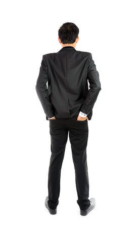 Businessman standing with back isolate on over white backgroundの写真素材