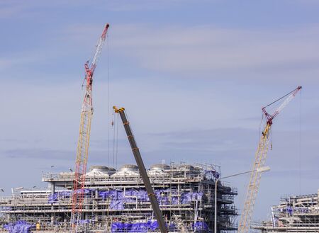 Industry crane and building construction site and blue sky