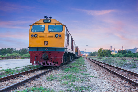Cargo train and container at twilight of Thailandのeditorial素材