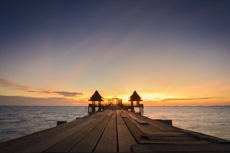 Twilight wood bridge at Djittabhawan Temple tourist attraction at Pattaya of Thailandの写真素材
