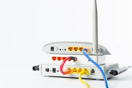 Wireless modem router network hub on white backgroundの写真素材