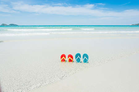 Beach, slippers on tropical beach in holiday at Thailandの写真素材