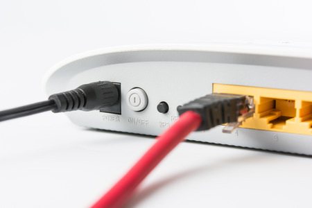 Wireless modem router network hub on white backgroundの写真素材
