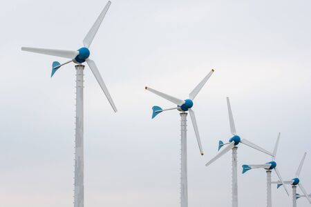 Wind power station against and light sunset, Power generation wind turbines