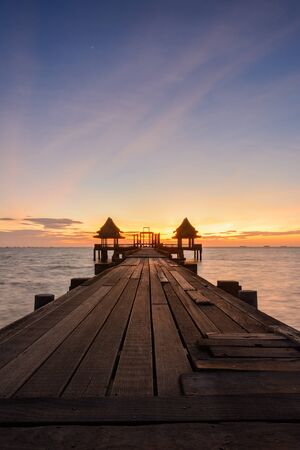 Twilight wood bridge at Djittabhawan Temple tourist attraction at Pattaya of Thailandの写真素材