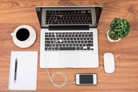 Top view laptop or notebook workspace office on wooden tableの写真素材